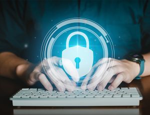 image of man typing on a keybord with the vision of a lock over all of it